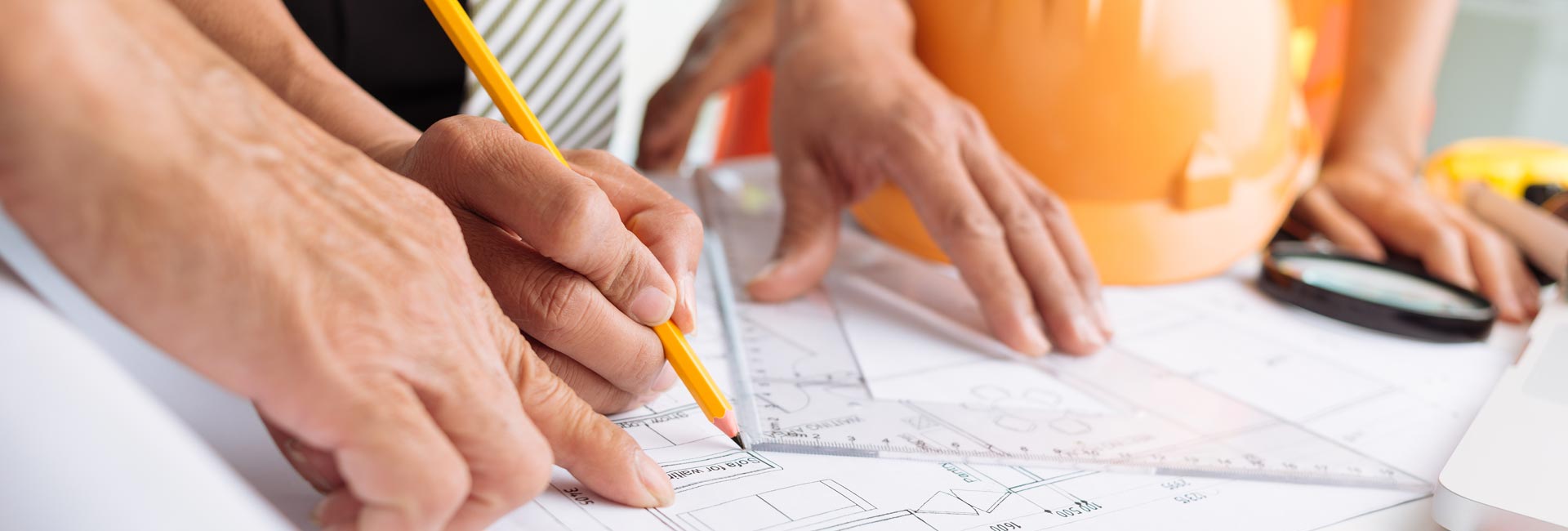 Engineers Working On Blueprint
